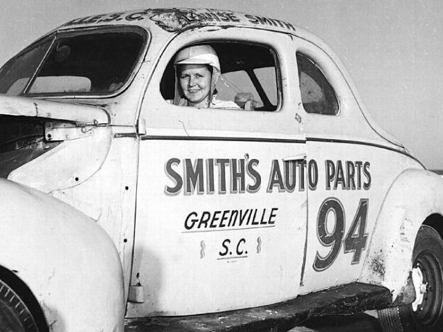 Louise Smith in a racecar. 