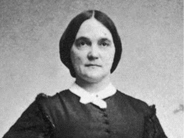Mary Boykin Chesnut wearing a dark dress with a crossed white collar. 