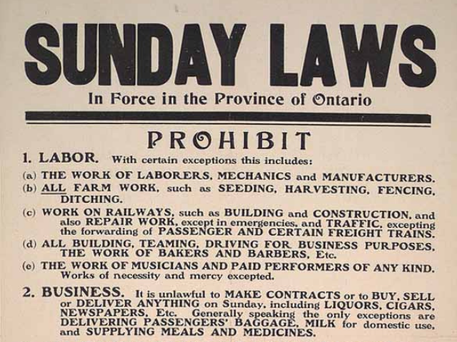 A yellowed sheet of rules with Sunday Laws written in large bold capital letters. 