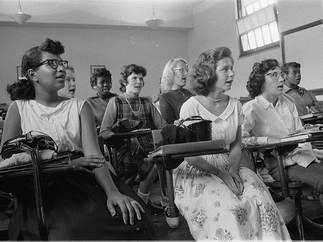 Black and white teens in a classroom