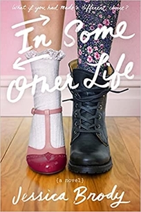 A pair of legs wears different clothes and shoes. One is wearing a pink dress shoe and the other wear a black boot.