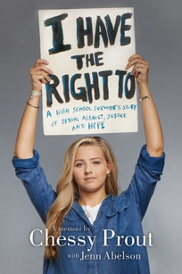 A young woman holds up a sign. 