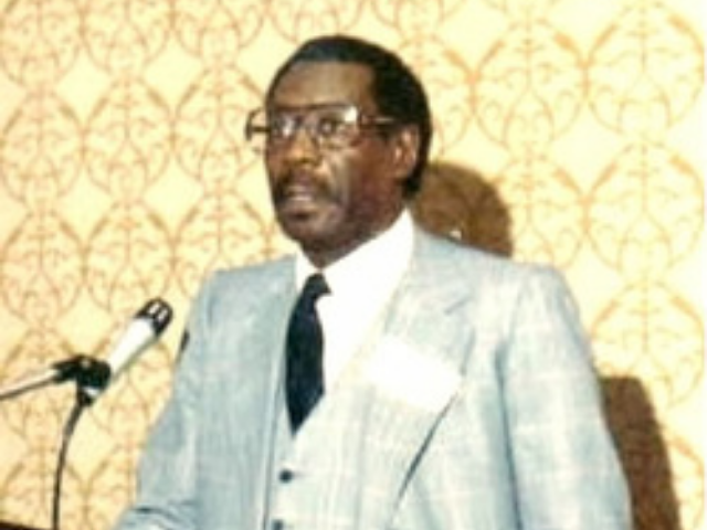 Dr. Gipson speaking at a microphone