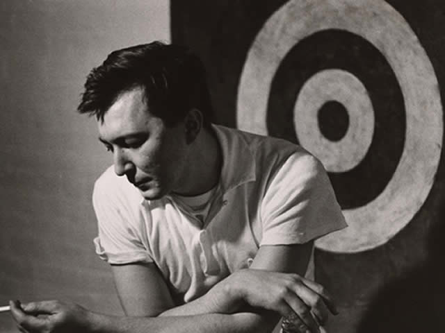 Jasper Johns with a bullseye in the background.