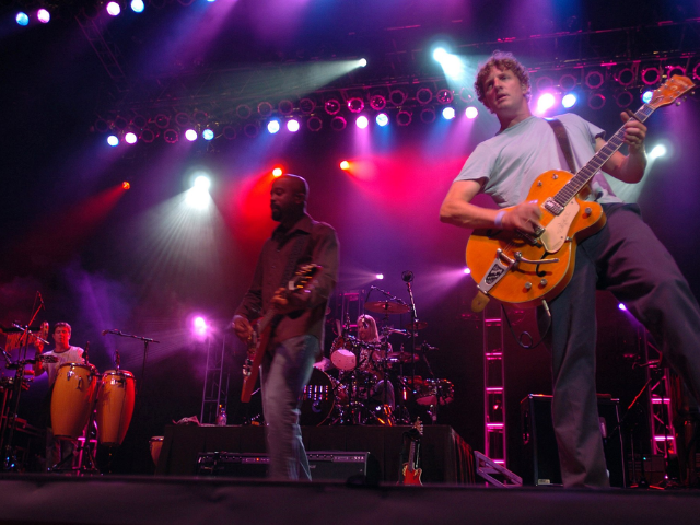 Rock band on stage under the bright lights